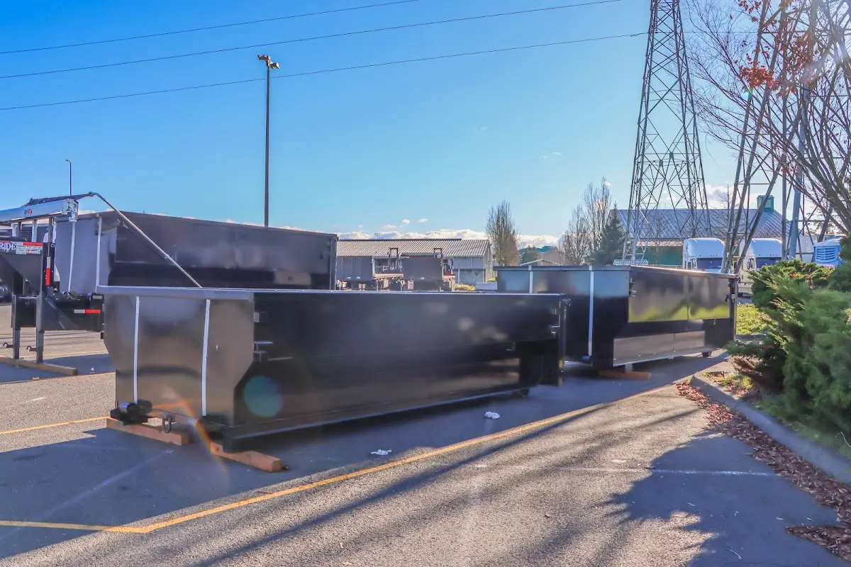 Roll-off dumpster ready for waste disposal at job site for 2 Yard Dumpster Rental in South Boston
